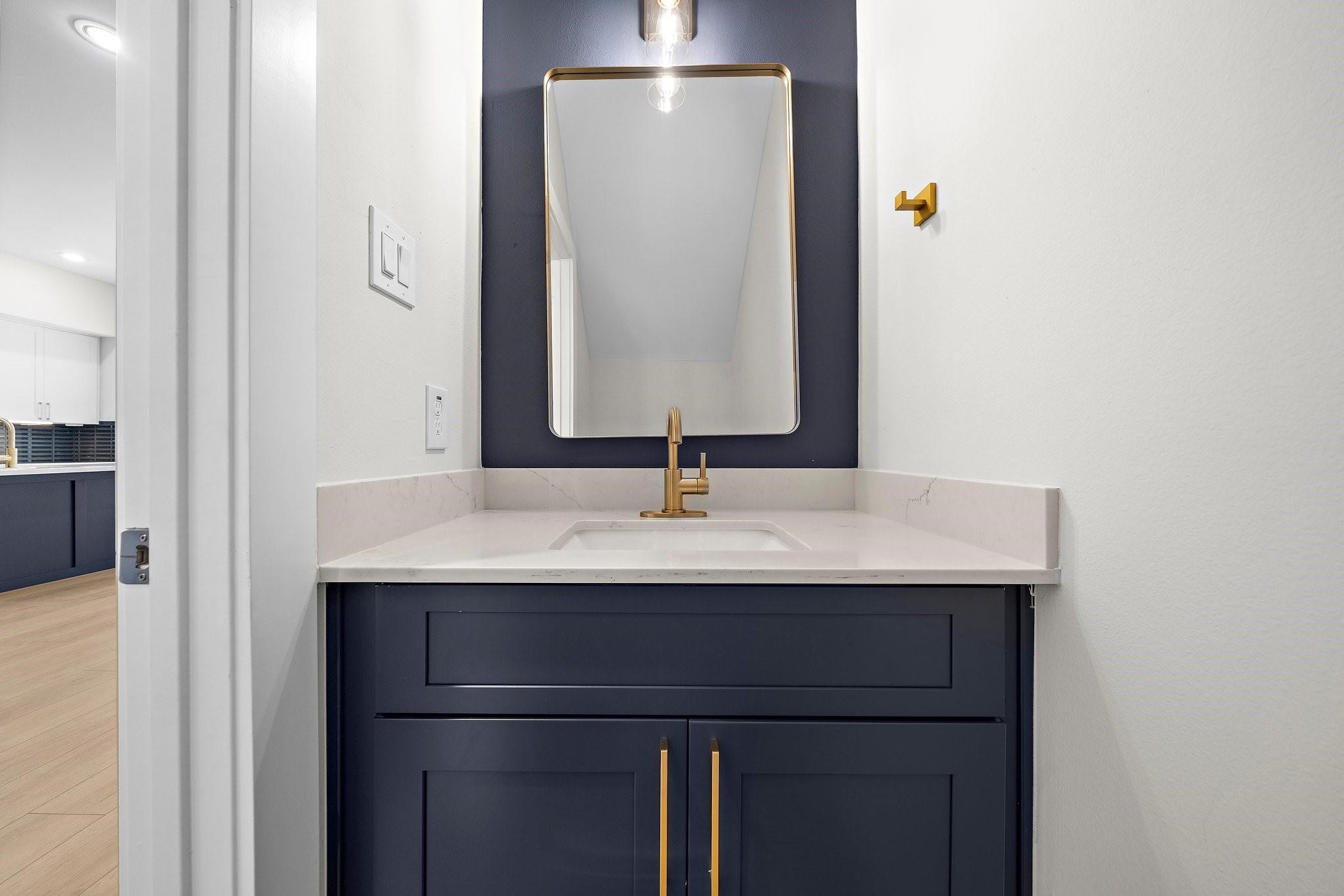 2200 Marnel Road, Unit J Houston, TX 77055 - Photo 5 of 25 a bathroom with a sink and a mirror