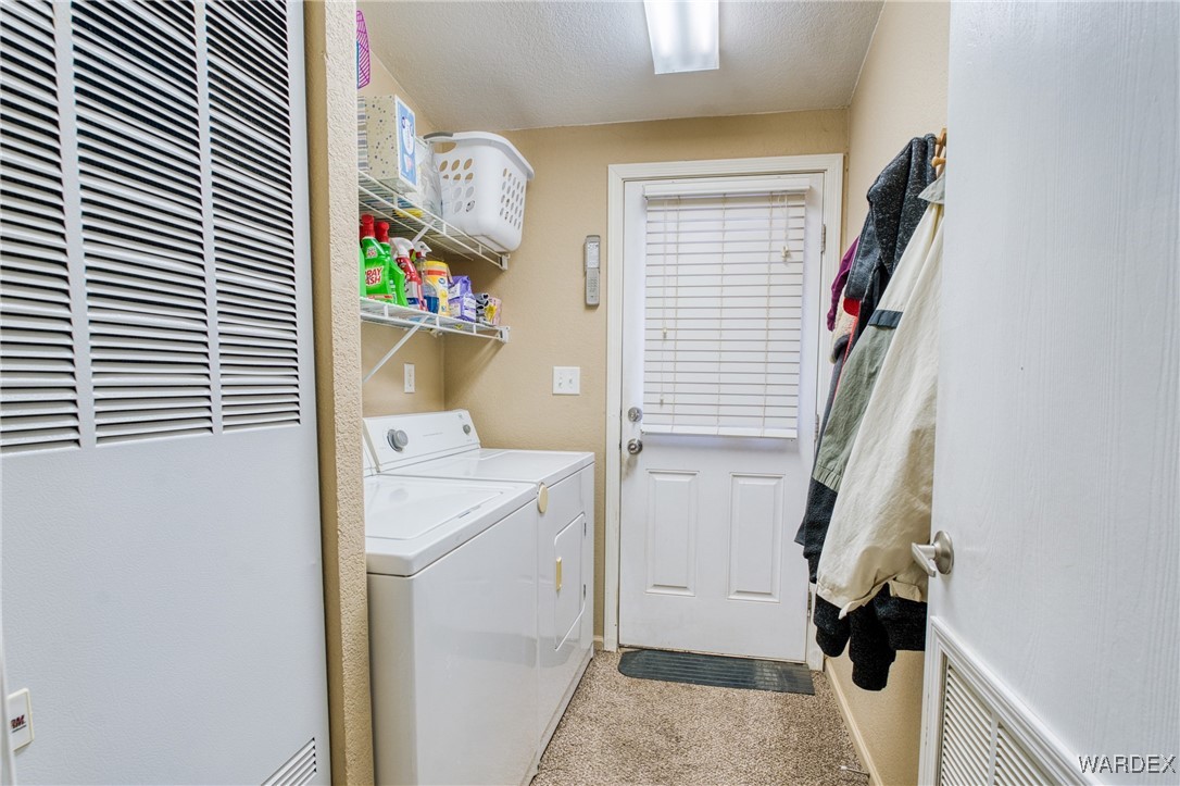 3690 Bouse Road Golden Valley, AZ 86413 - Photo 23 of 47 a view of hallway with stairs and furniture