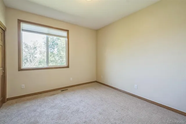 a balcony with wooden floor