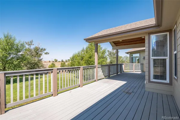 a balcony with wooden floor