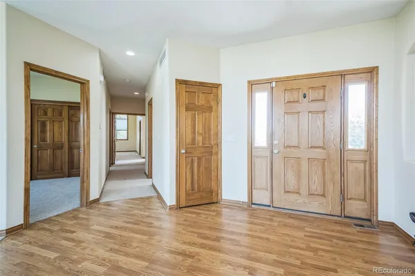 a view of entryway with wooden floor