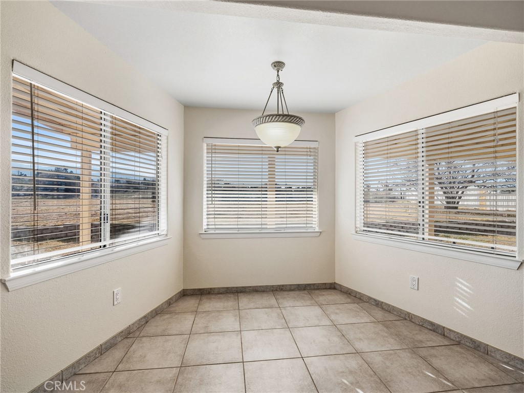 9550 Riggins Road Phelan, CA 92371 - Photo 15 of 47 a view of an empty room with a window