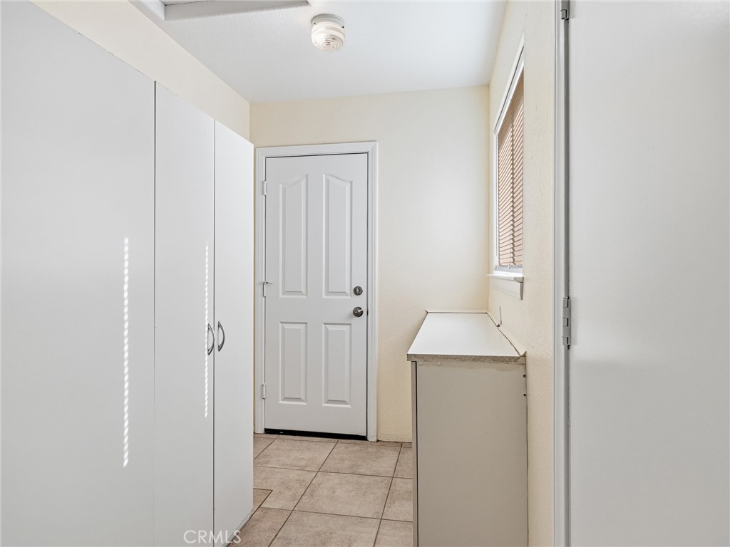 9550 Riggins Road Phelan, CA 92371 - Photo 16 of 47 a hallway with sink and a mirror