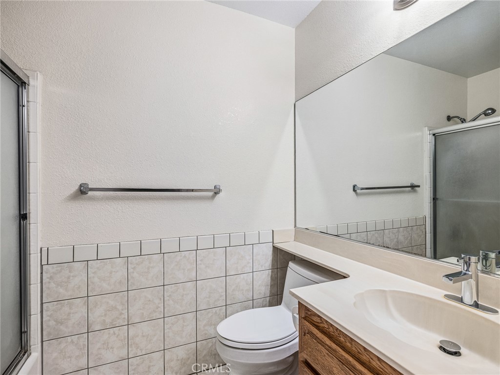 9550 Riggins Road Phelan, CA 92371 - Photo 17 of 47 a bathroom with a sink toilet and shower