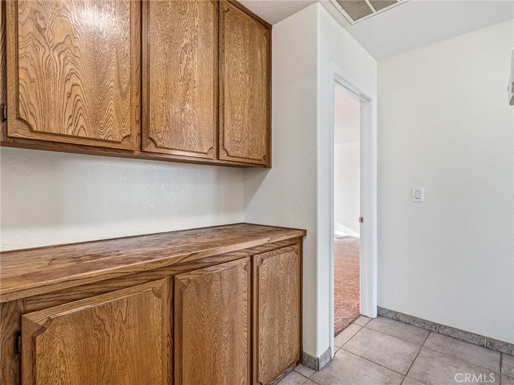 9550 Riggins Road Phelan, CA 92371 - Photo 18 of 47 a view of a utility room with cabinets