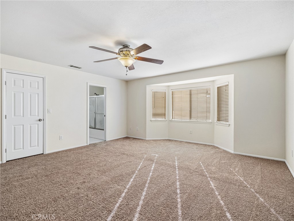 9550 Riggins Road Phelan, CA 92371 - Photo 21 of 47 a view of an empty room with a window