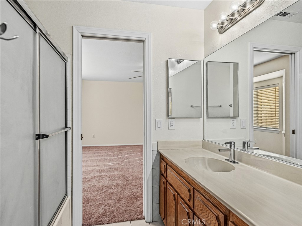 9550 Riggins Road Phelan, CA 92371 - Photo 24 of 47 a bathroom with a sink and a mirror