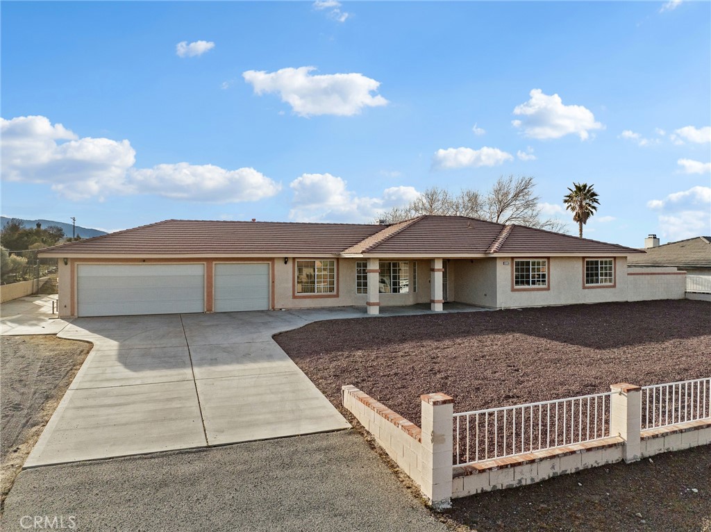 9550 Riggins Road Phelan, CA 92371 - Photo 39 of 47 a front view of a house with a yard