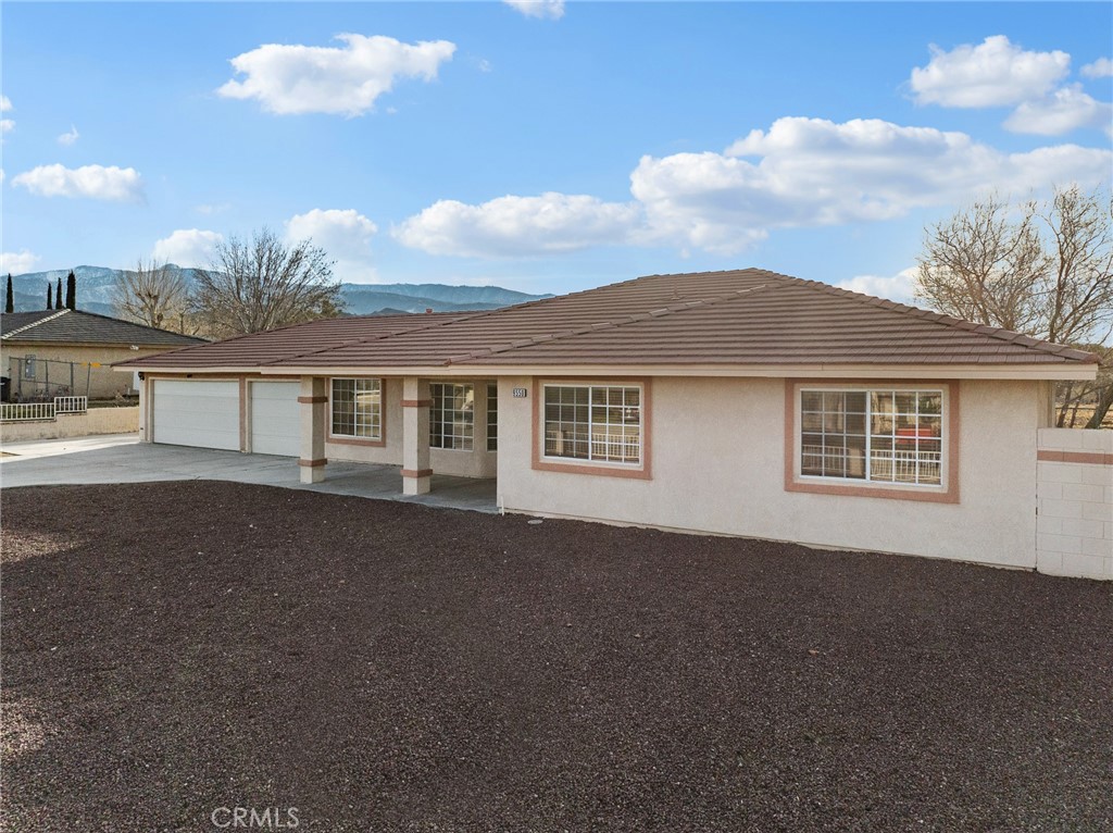 9550 Riggins Road Phelan, CA 92371 - Photo 40 of 47 a front view of a house with a yard
