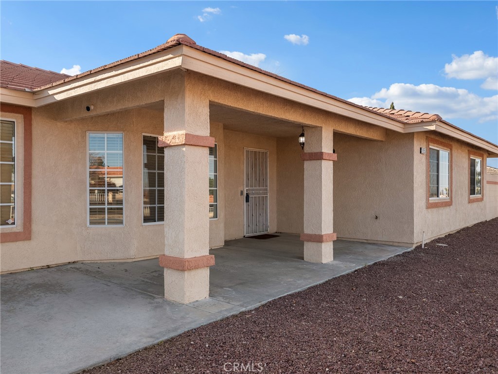 9550 Riggins Road Phelan, CA 92371 - Photo 42 of 47 a front view of a house with a garage