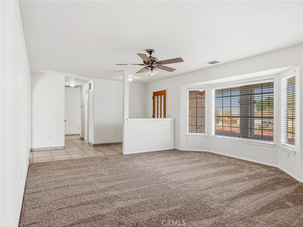 9550 Riggins Road Phelan, CA 92371 - Photo 6 of 47 a view of an empty room with a window