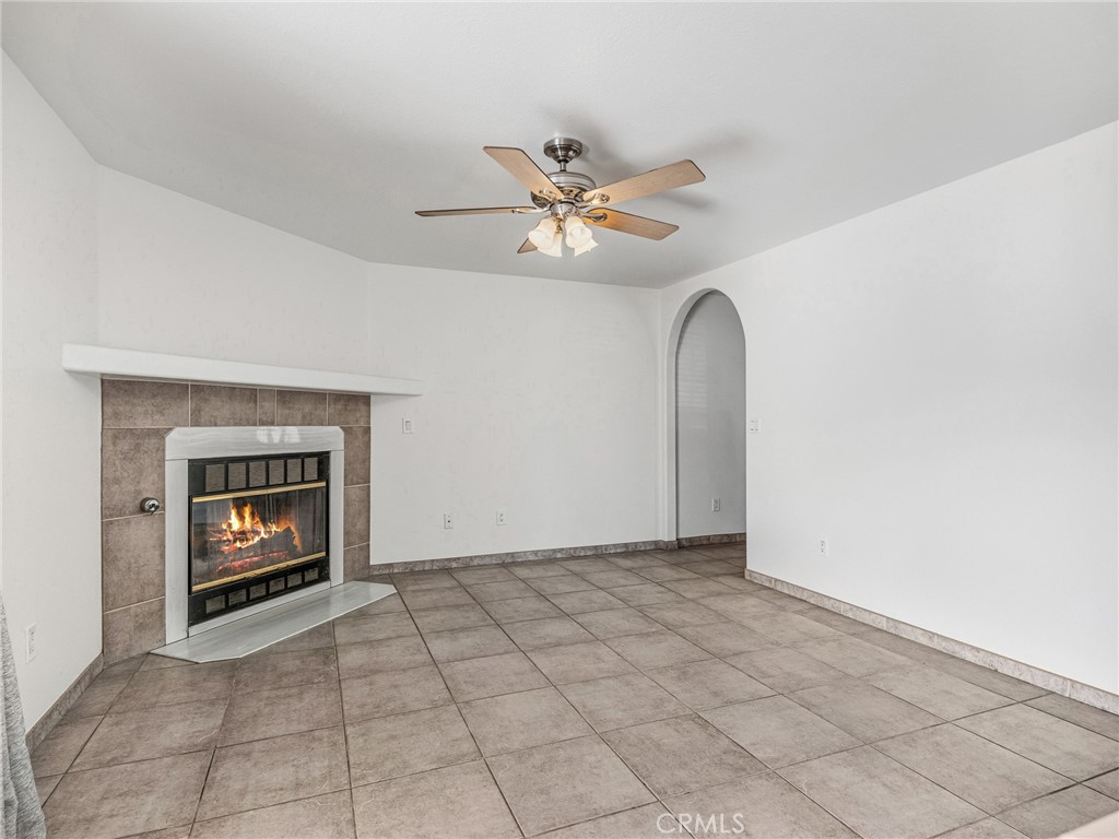 9550 Riggins Road Phelan, CA 92371 - Photo 10 of 47 an empty room with windows and fan