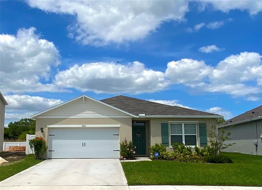 1818 Myrtlebrooke Drive Edgewater, FL 32141 - Photo 1 of 23 a view of a white house next to a yard