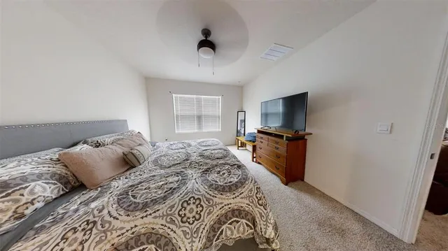 a kitchen with a sink and white cabinets