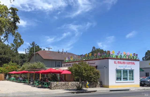 a front view of a building with garden