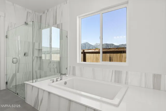 a bathroom with a tub sink and shower