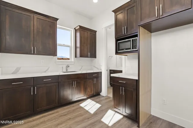 a kitchen with stainless steel appliances a refrigerator and a sink