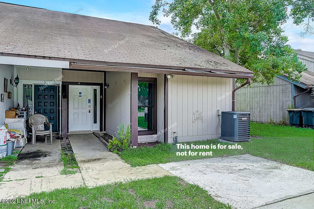 10740 Alden Road, Unit 4 Jacksonville, FL 32246 - Photo 12 of 28 a front view of a house with garden