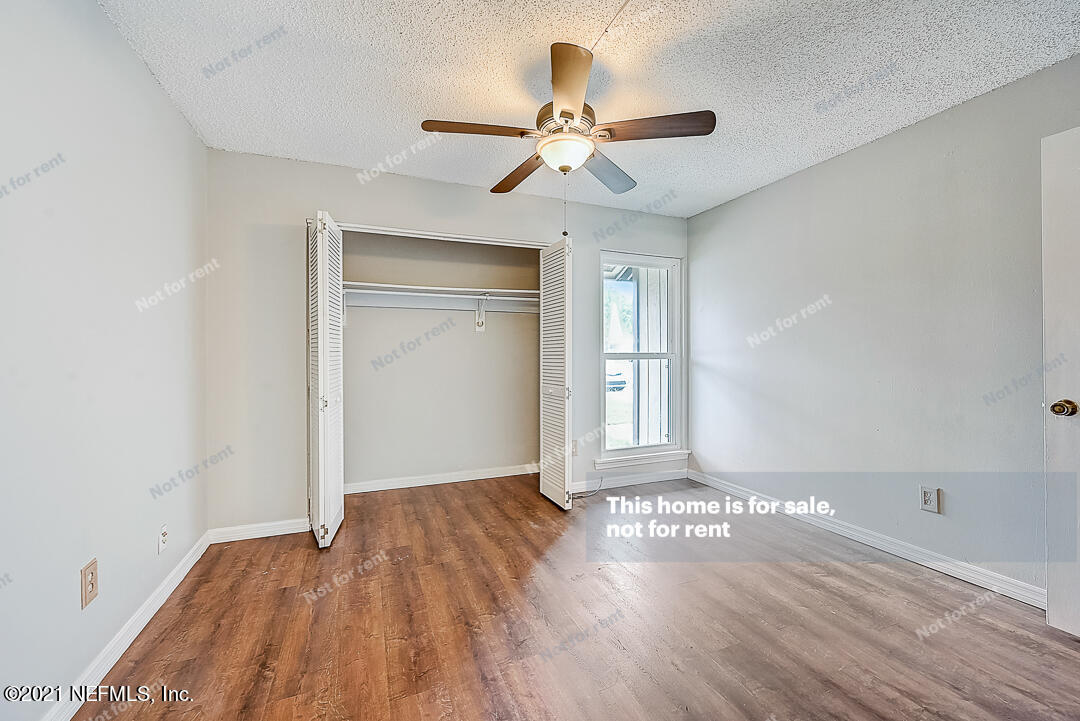 10740 Alden Road, Unit 4 Jacksonville, FL 32246 - Photo 18 of 28 wooden floor in an empty room with a window