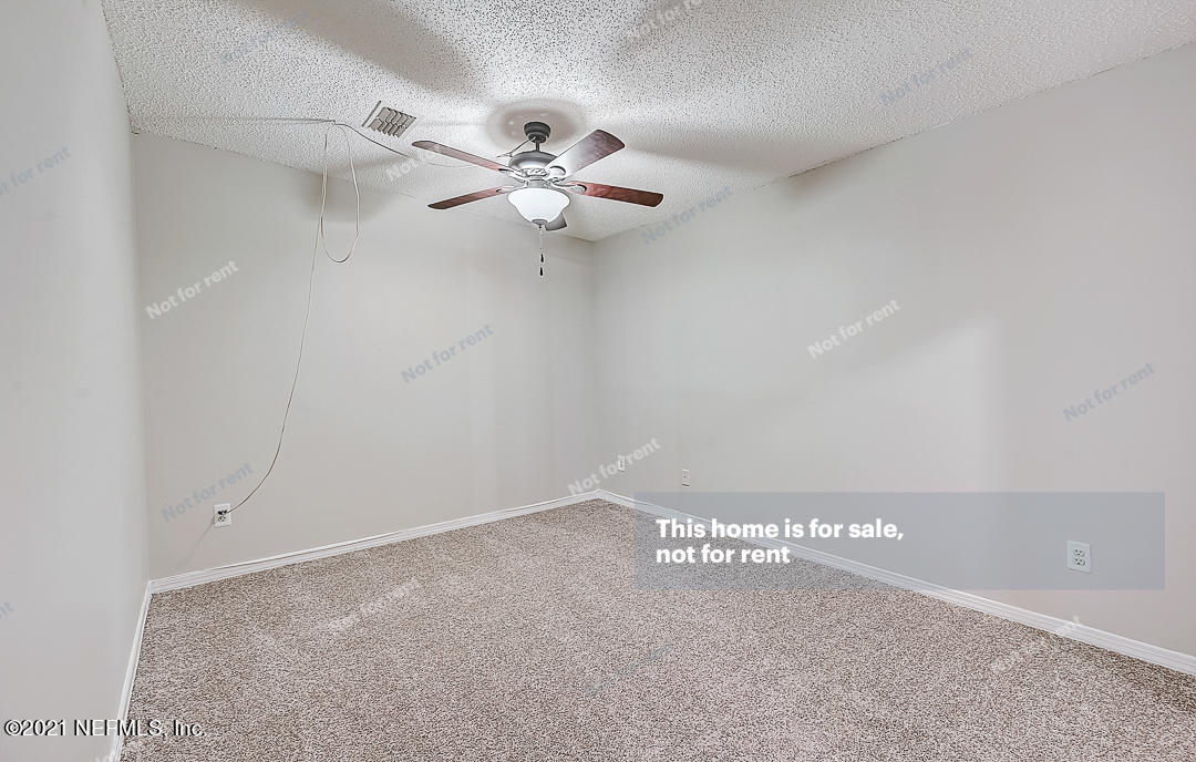 10740 Alden Road, Unit 4 Jacksonville, FL 32246 - Photo 20 of 28 a view of a ceiling fan with a fan