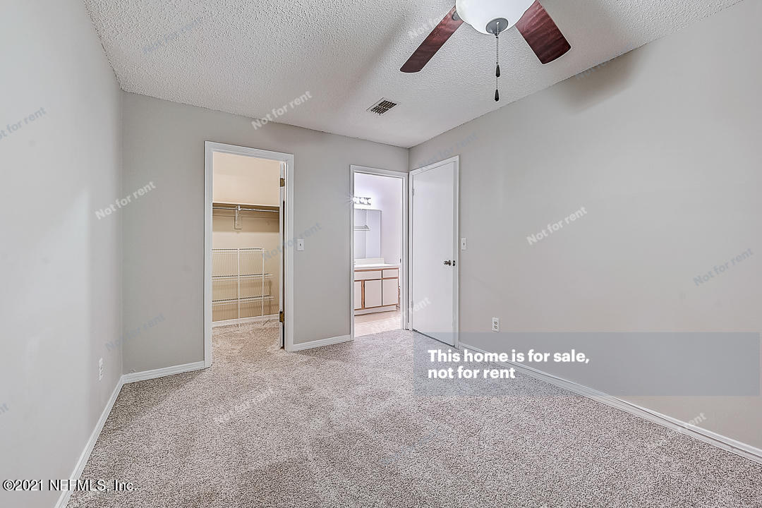 10740 Alden Road, Unit 4 Jacksonville, FL 32246 - Photo 21 of 28 an empty room with closet and windows