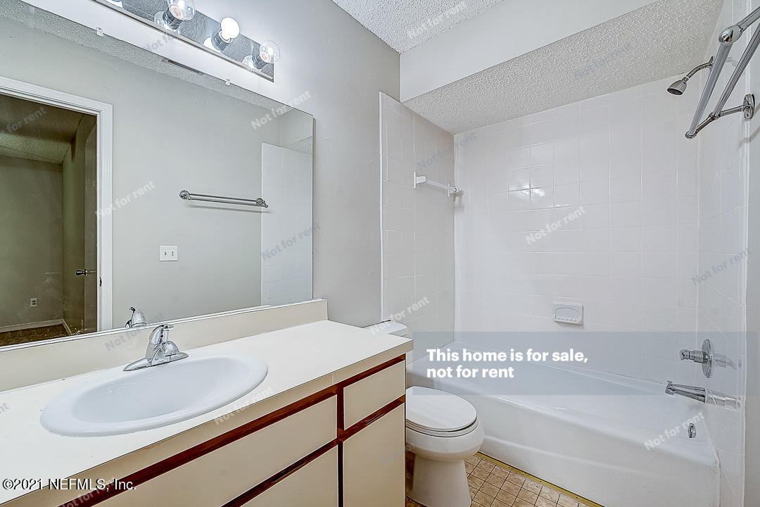 10740 Alden Road, Unit 4 Jacksonville, FL 32246 - Photo 23 of 28 a bathroom with a sink a toilet and shower