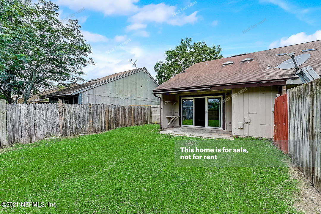 10740 Alden Road, Unit 4 Jacksonville, FL 32246 - Photo 26 of 28 a view of a house with a garden