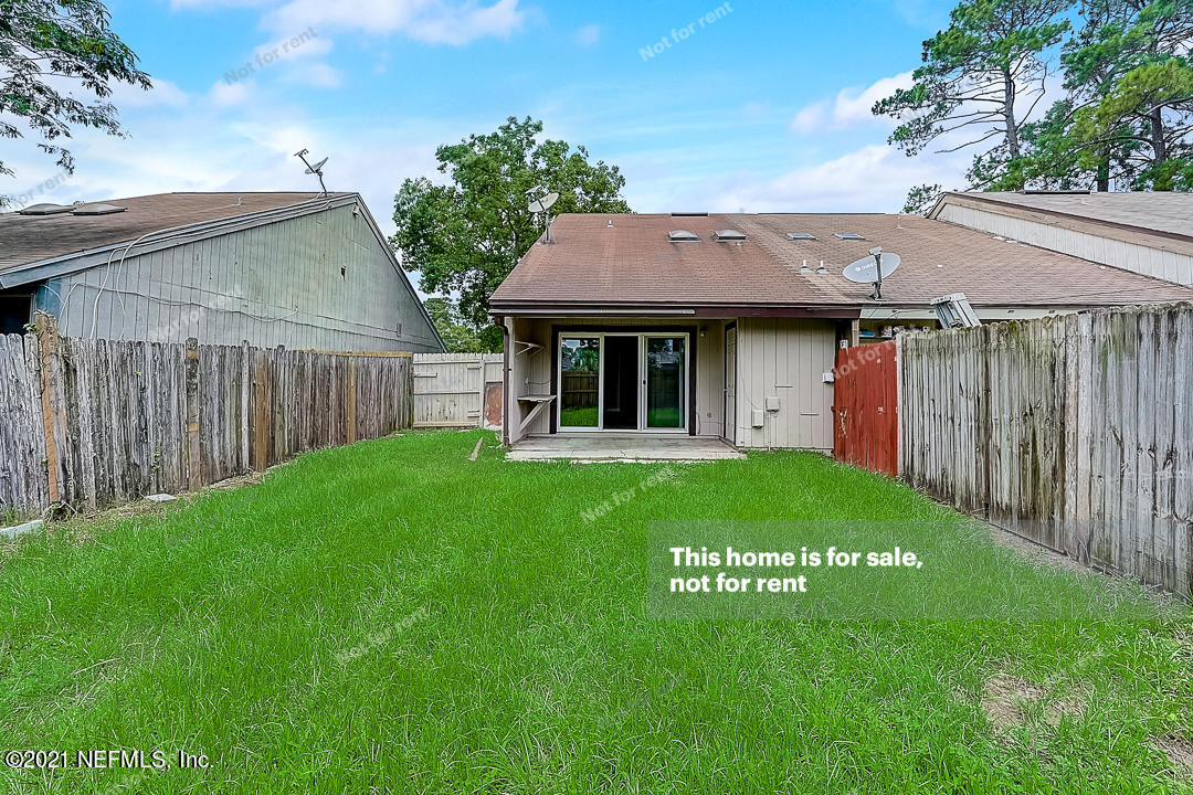 10740 Alden Road, Unit 4 Jacksonville, FL 32246 - Photo 27 of 28 a view of a house with a garden
