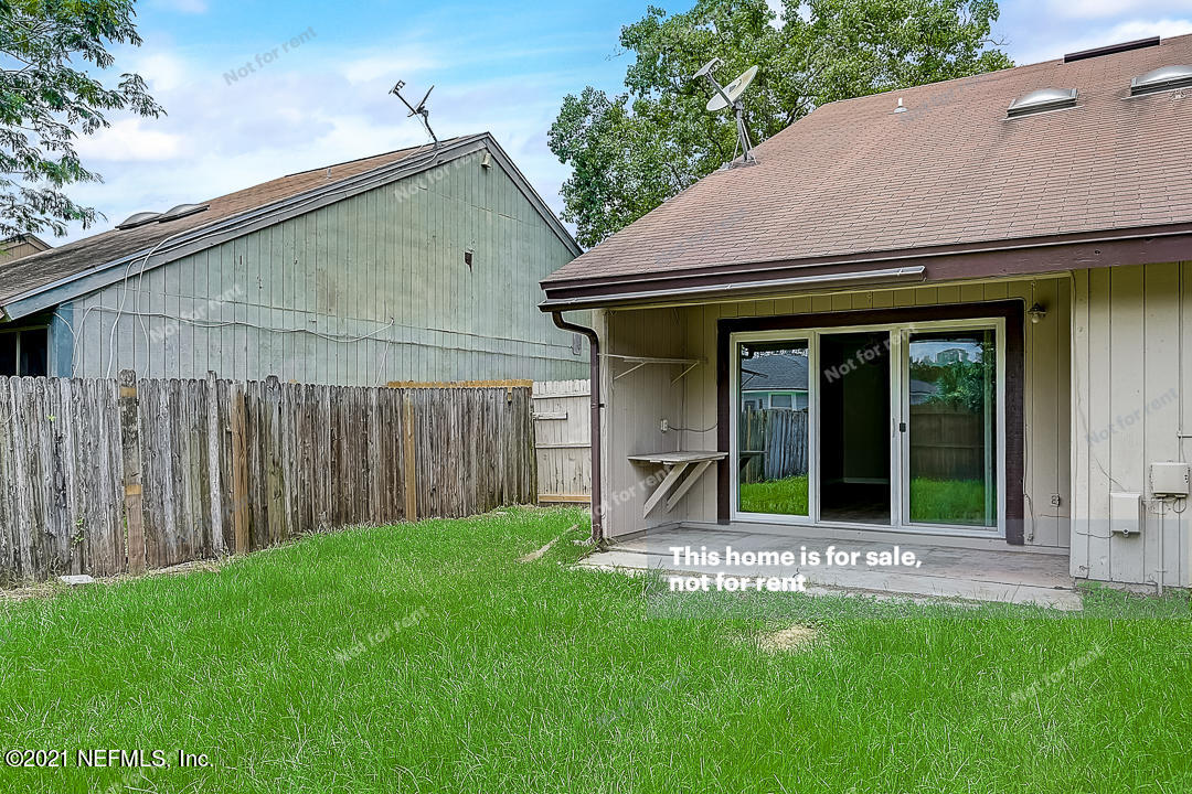 10740 Alden Road, Unit 4 Jacksonville, FL 32246 - Photo 9 of 28 a view of a house with backyard