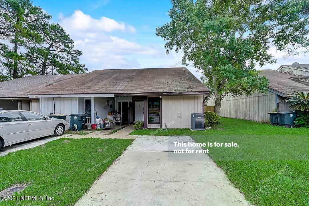 10740 Alden Road, Unit 4 Jacksonville, FL 32246 - Photo 10 of 28 a front view of house with a garden and patio