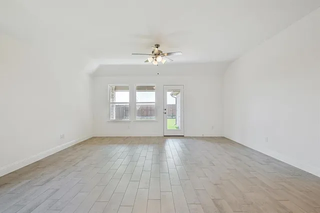 a view of empty room with windows