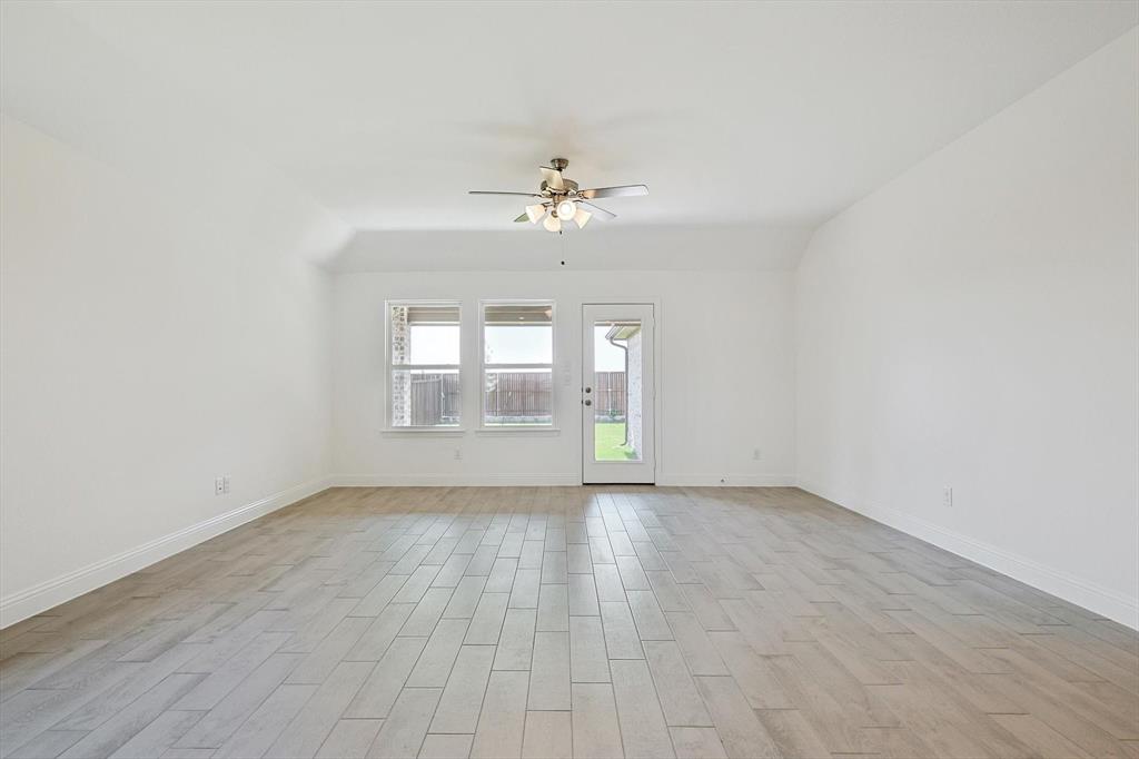 321 Portina Drive Anna, TX 75409 - Photo 15 of 35 wooden floor in an empty room with a window