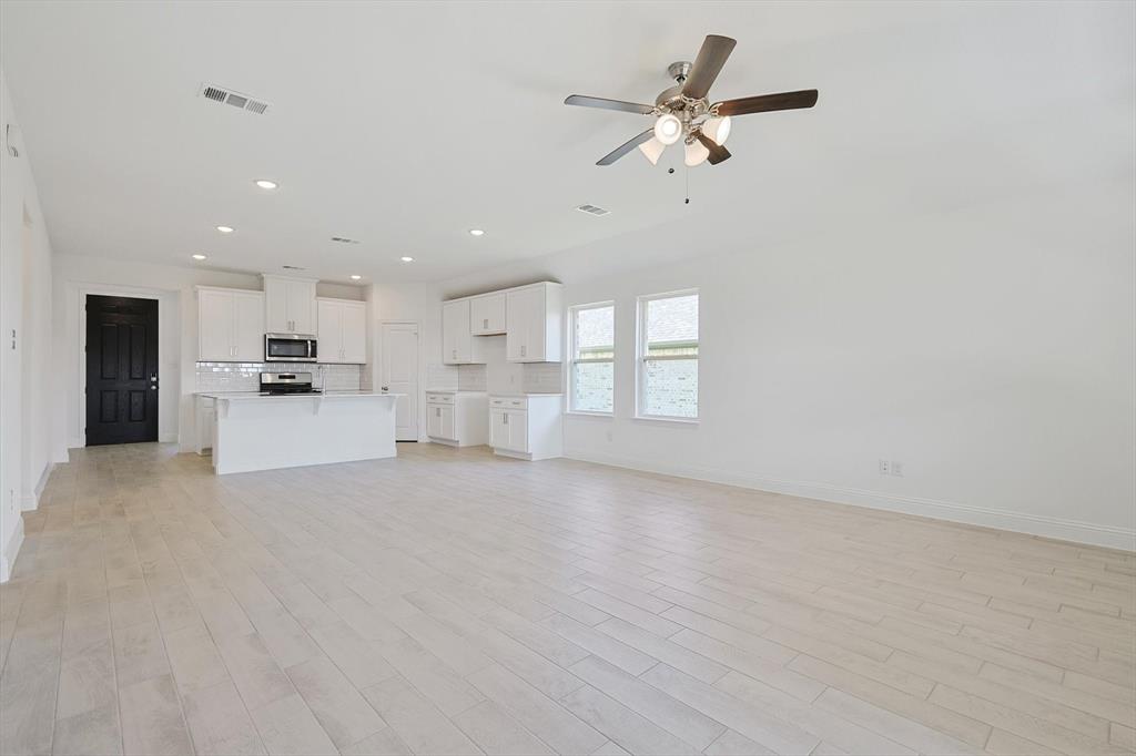 321 Portina Drive Anna, TX 75409 - Photo 18 of 35 a view of a kitchen with furniture and a kitchen