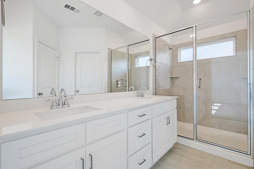 321 Portina Drive Anna, TX 75409 - Photo 23 of 35 a bathroom with a double vanity sink mirror and shower