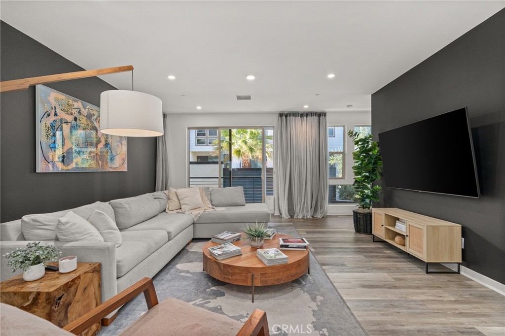 217 Placemark Irvine, CA 92614 - Photo 1 of 39 a living room with furniture and a flat screen tv