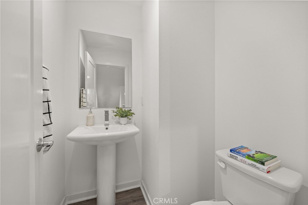 217 Placemark Irvine, CA 92614 - Photo 15 of 39 a bathroom with a sink mirror and toilet