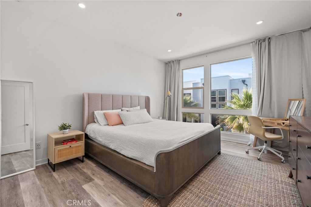 217 Placemark Irvine, CA 92614 - Photo 17 of 39 a bedroom with a bed and large windows