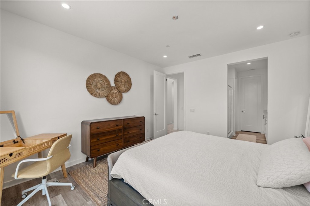 217 Placemark Irvine, CA 92614 - Photo 18 of 39 a bedroom with a bed and cabinets