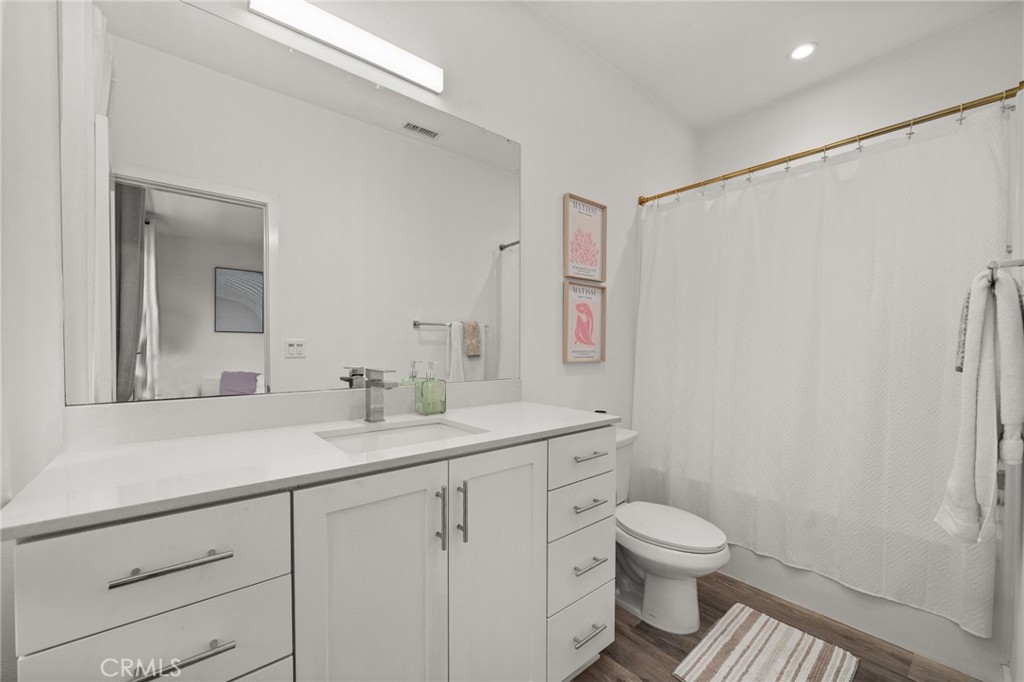 217 Placemark Irvine, CA 92614 - Photo 23 of 39 a bathroom with a toilet sink and mirror