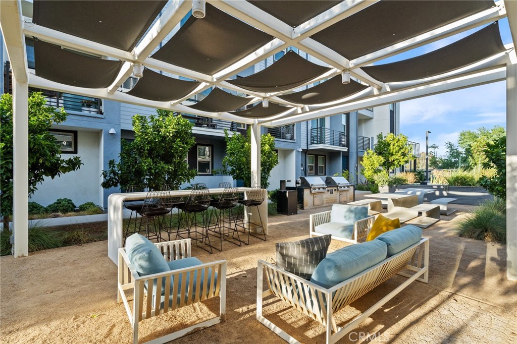 217 Placemark Irvine, CA 92614 - Photo 35 of 39 a view of a patio with couches table and chairs and potted plants
