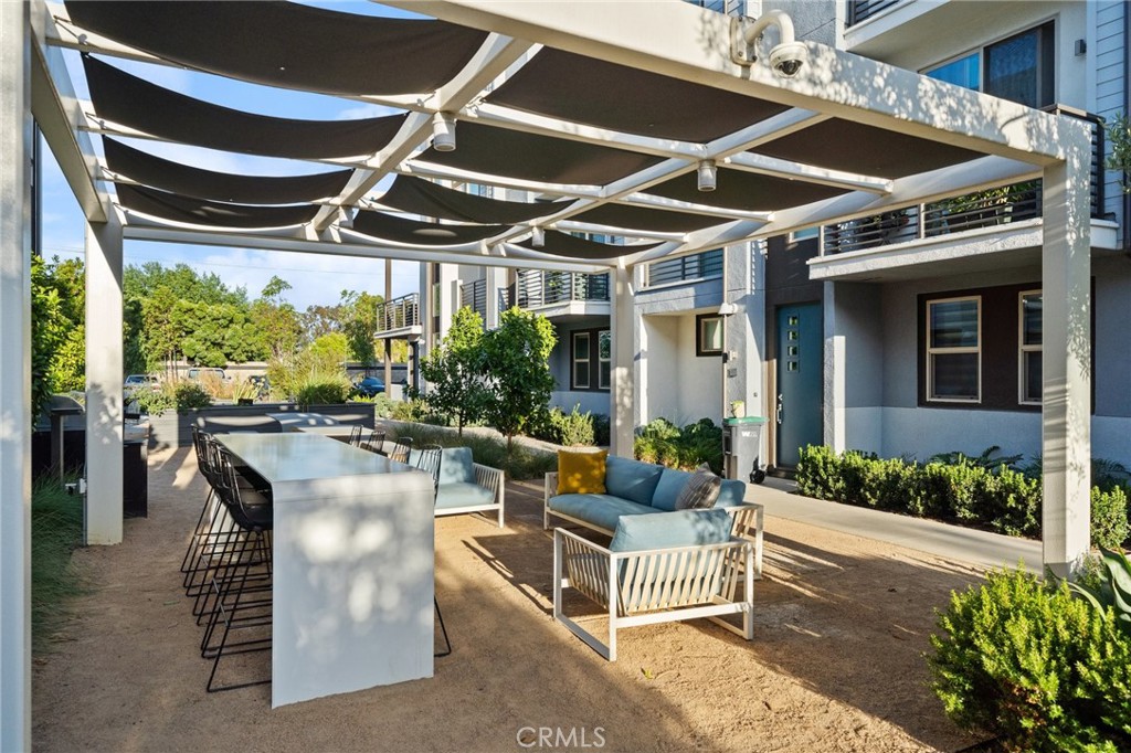 217 Placemark Irvine, CA 92614 - Photo 37 of 39 a building outdoor space with patio furniture and potted plants