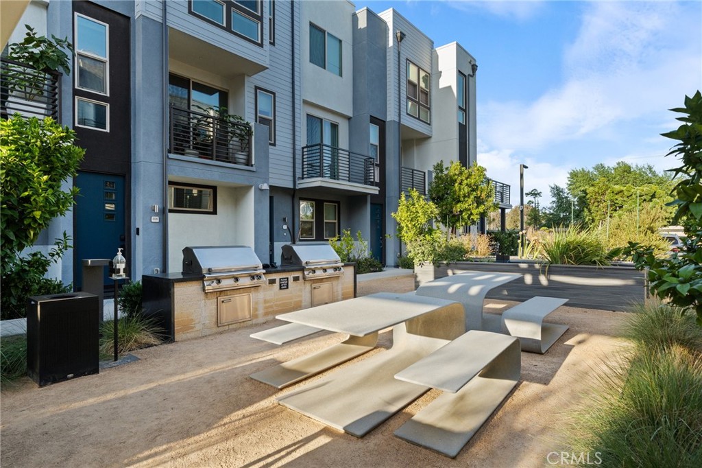 217 Placemark Irvine, CA 92614 - Photo 38 of 39 a view of a patio with couches table and chairs and potted plants