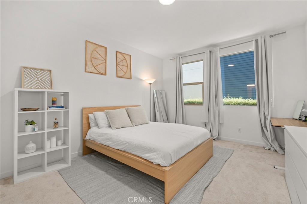 217 Placemark Irvine, CA 92614 - Photo 4 of 39 a bedroom with a bed and a cabinets