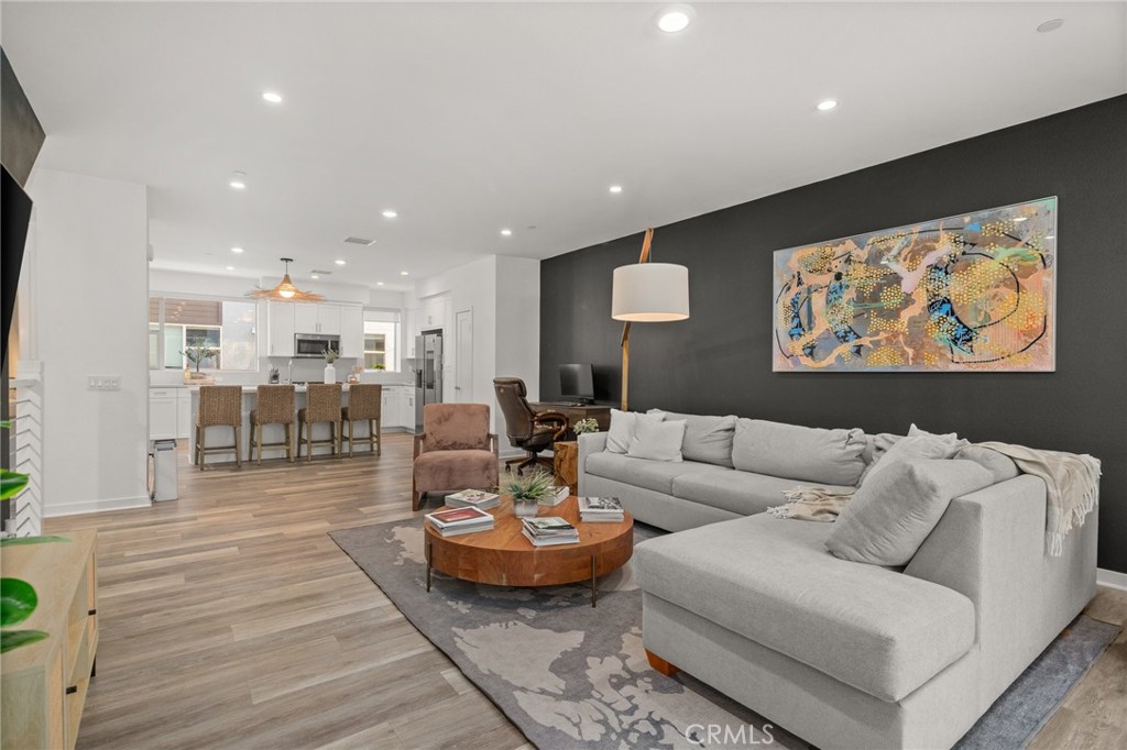 217 Placemark Irvine, CA 92614 - Photo 8 of 39 a living room with furniture and kitchen view