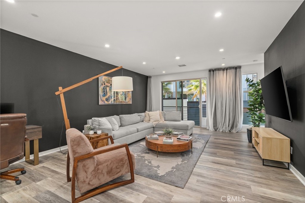 217 Placemark Irvine, CA 92614 - Photo 10 of 39 a living room with furniture and a flat screen tv