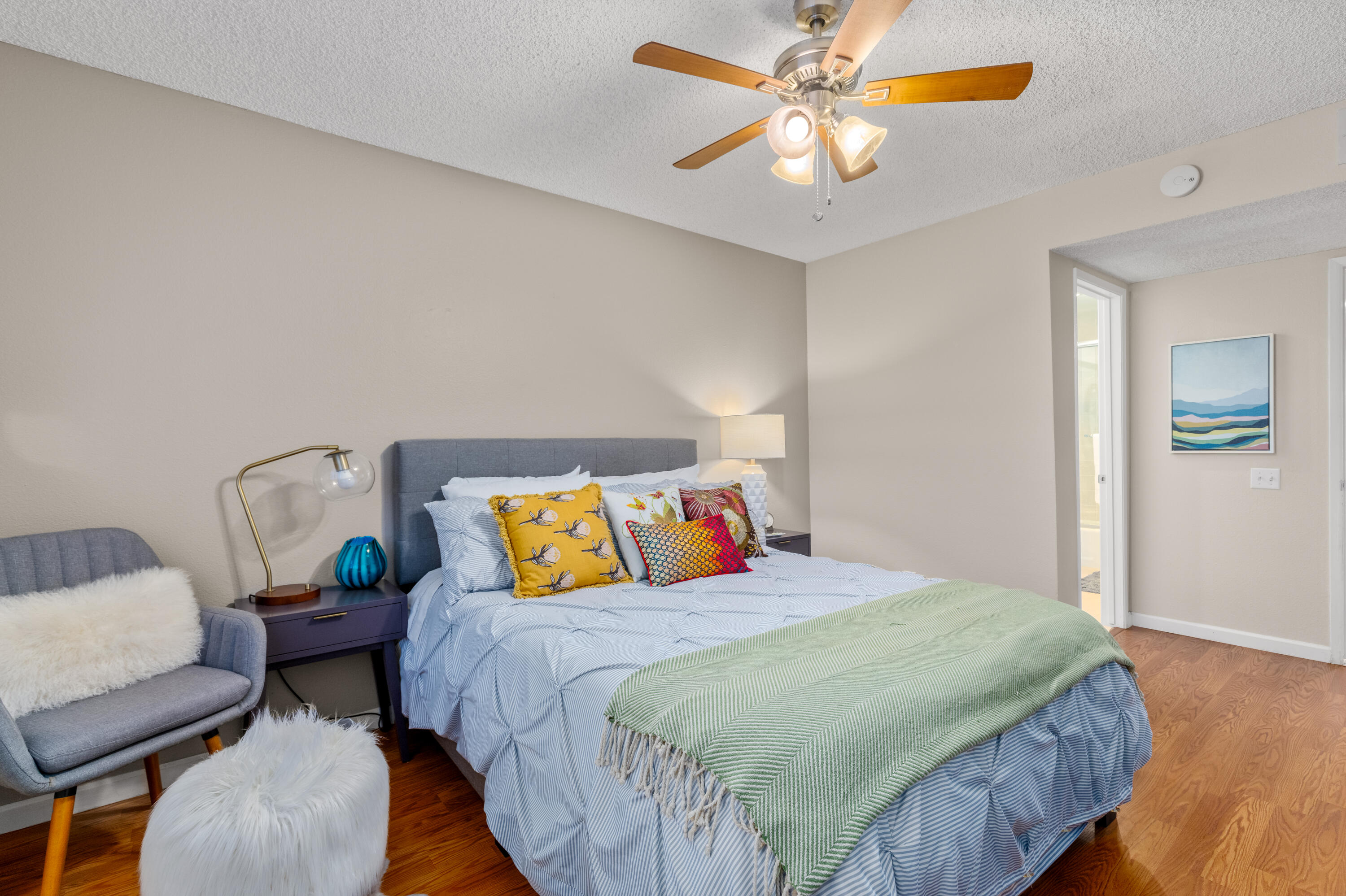 71828 Eleanora Lane Rancho Mirage, CA 92270 - Photo 18 of 37 a bedroom with a bed and a chandelier
