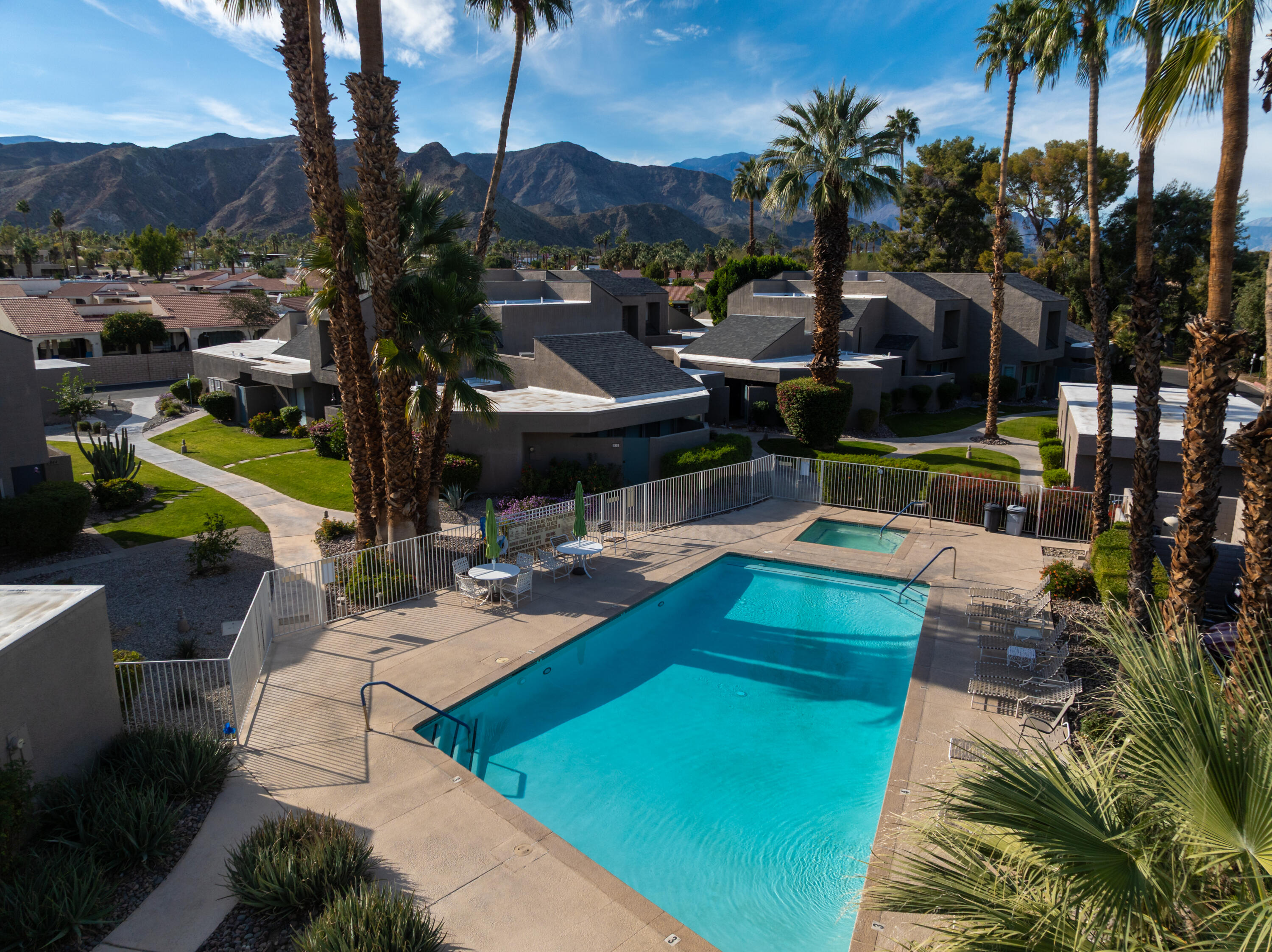 71828 Eleanora Lane Rancho Mirage, CA 92270 - Photo 30 of 37 a view of a swimming pool with a patio and a garden