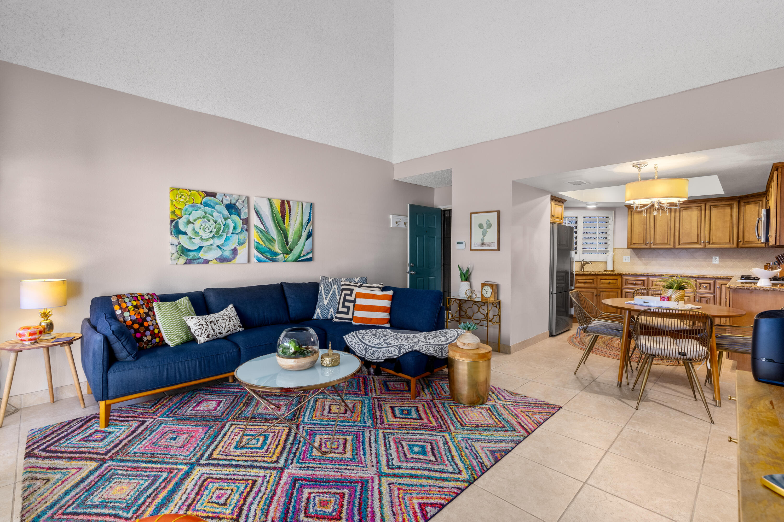71828 Eleanora Lane Rancho Mirage, CA 92270 - Photo 4 of 37 a living room with furniture and a dining table with rug