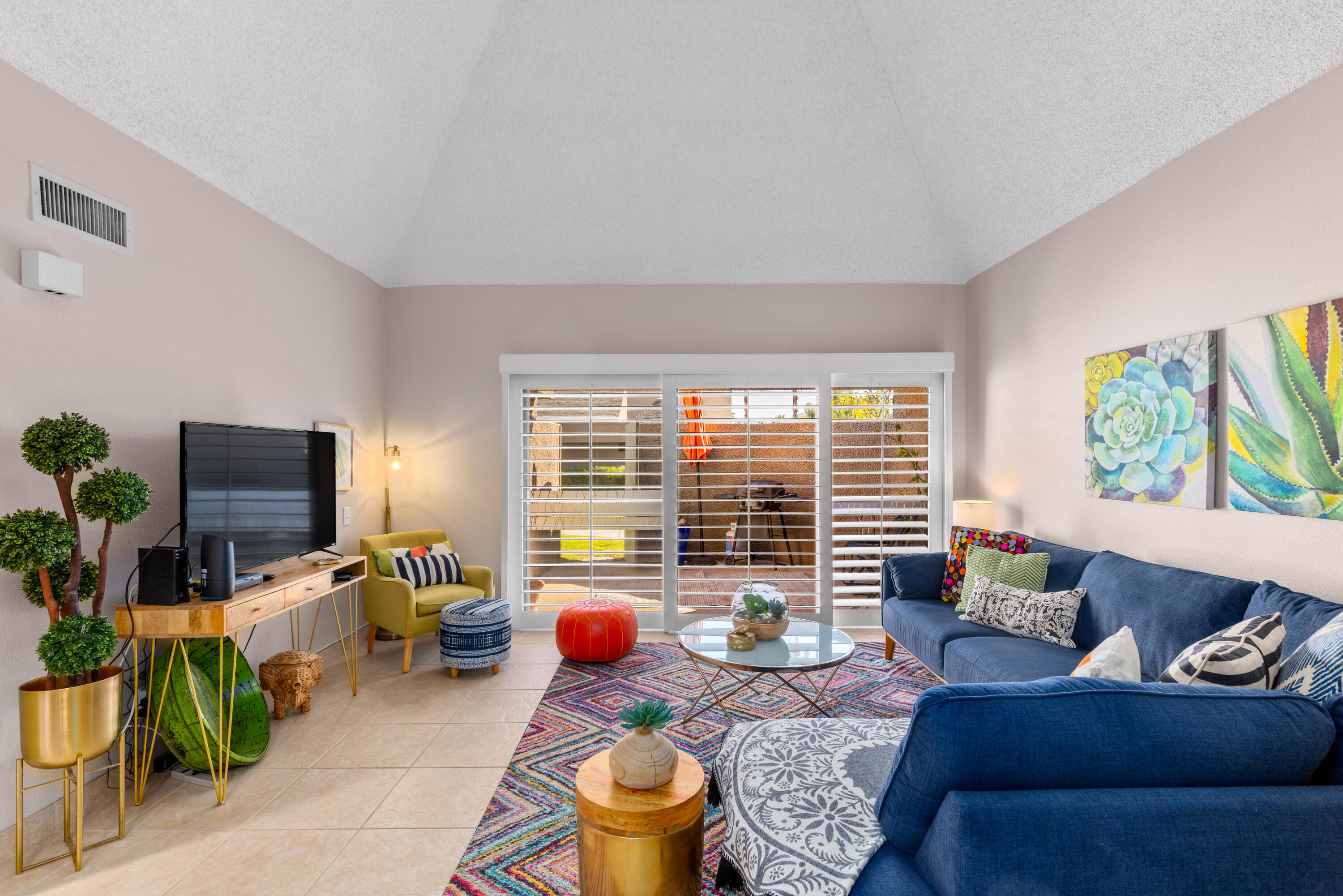 71828 Eleanora Lane Rancho Mirage, CA 92270 - Photo 6 of 37 a living room with furniture and a flat screen tv
