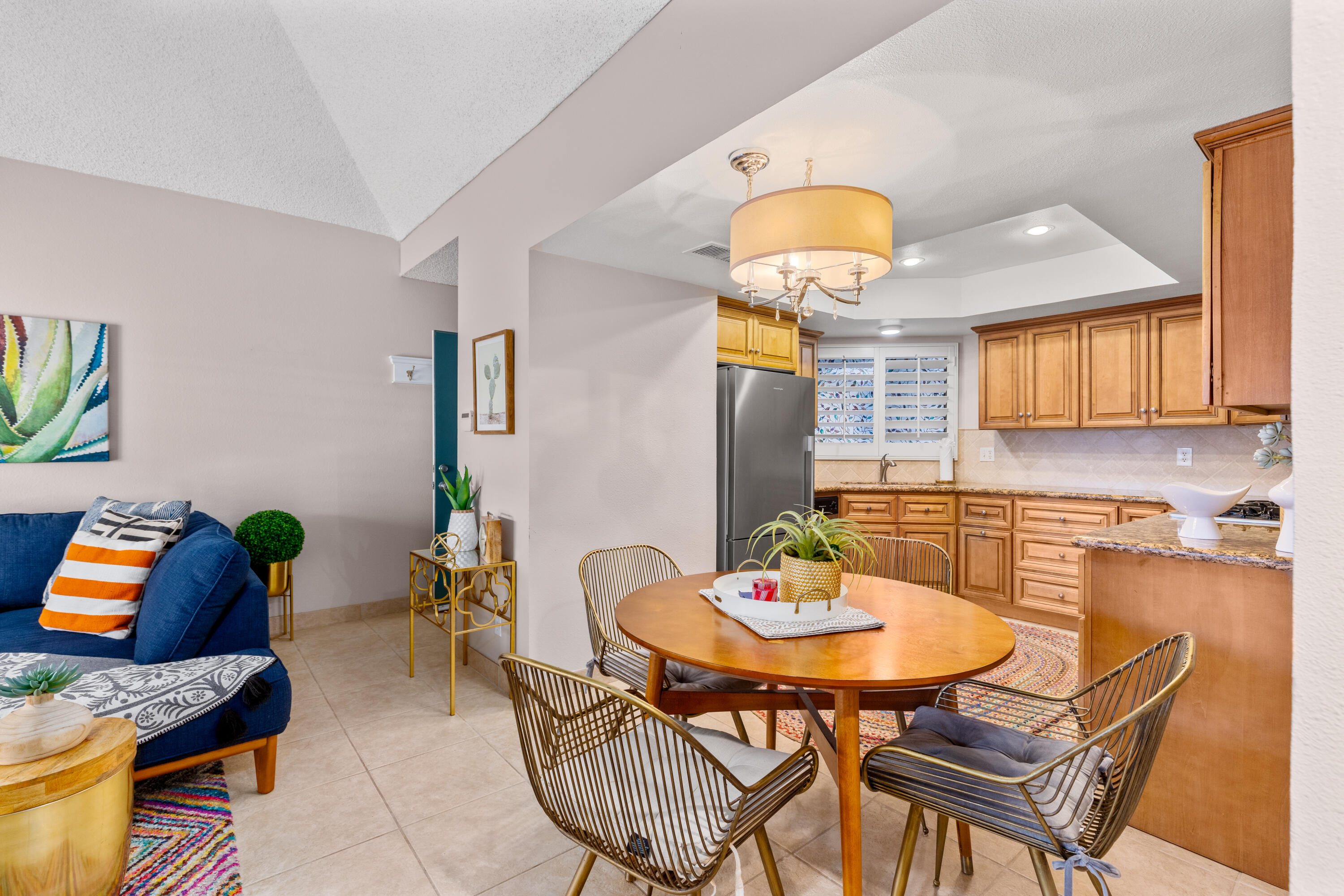71828 Eleanora Lane Rancho Mirage, CA 92270 - Photo 10 of 37 a view of a dining room with furniture and a potted plant